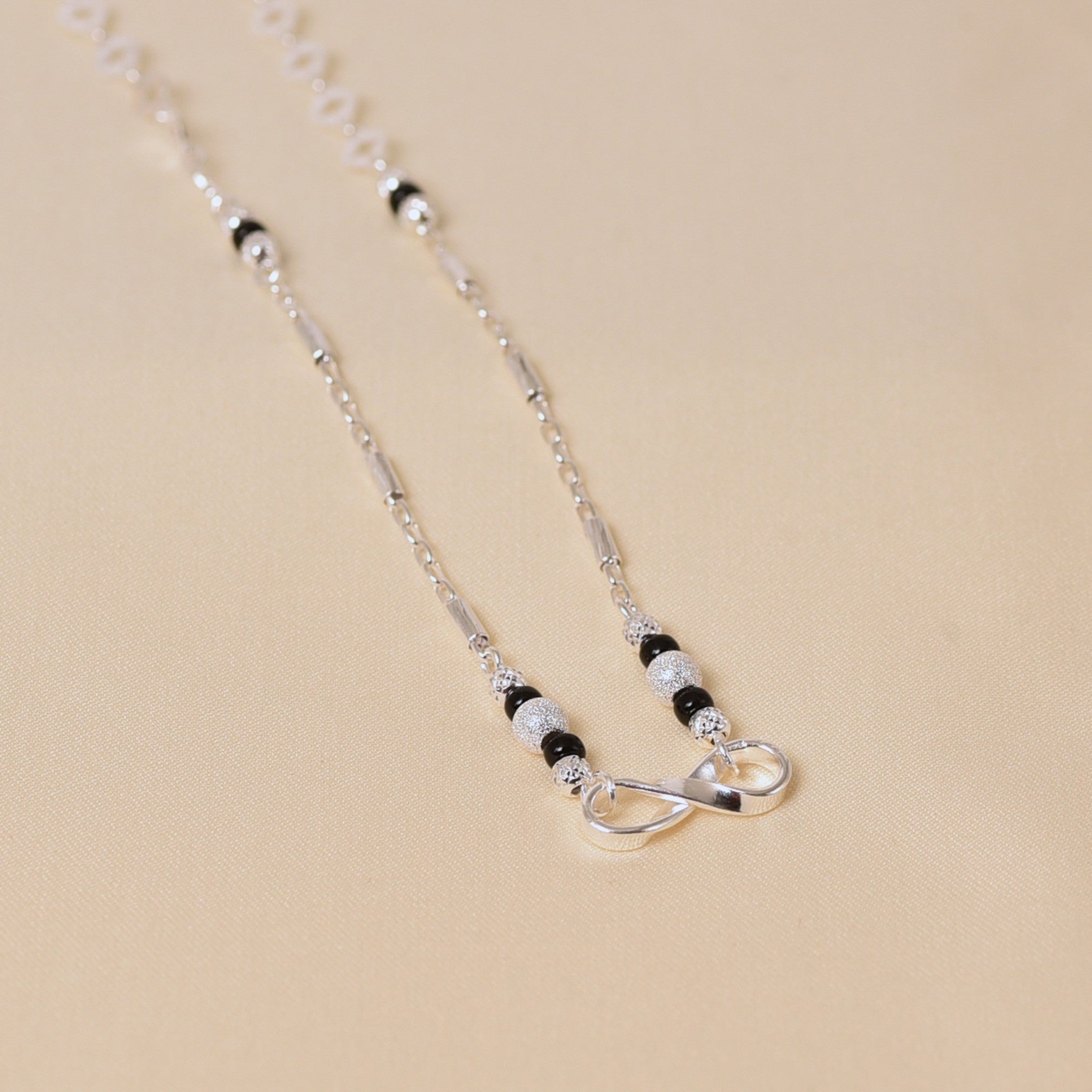 Infinity design Mangalsutra with black beads in SIlver for Women by Elyta