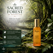 A bottle of Elyta Sacred Forest 20ml oil stands on a mossy forest floor with lush green foliage and a misty forest background. The left side features text panels describing the Sacred Forest of Meghalaya, including its natural sanctuary status, cultural sanctity, and pure, untamed nature.