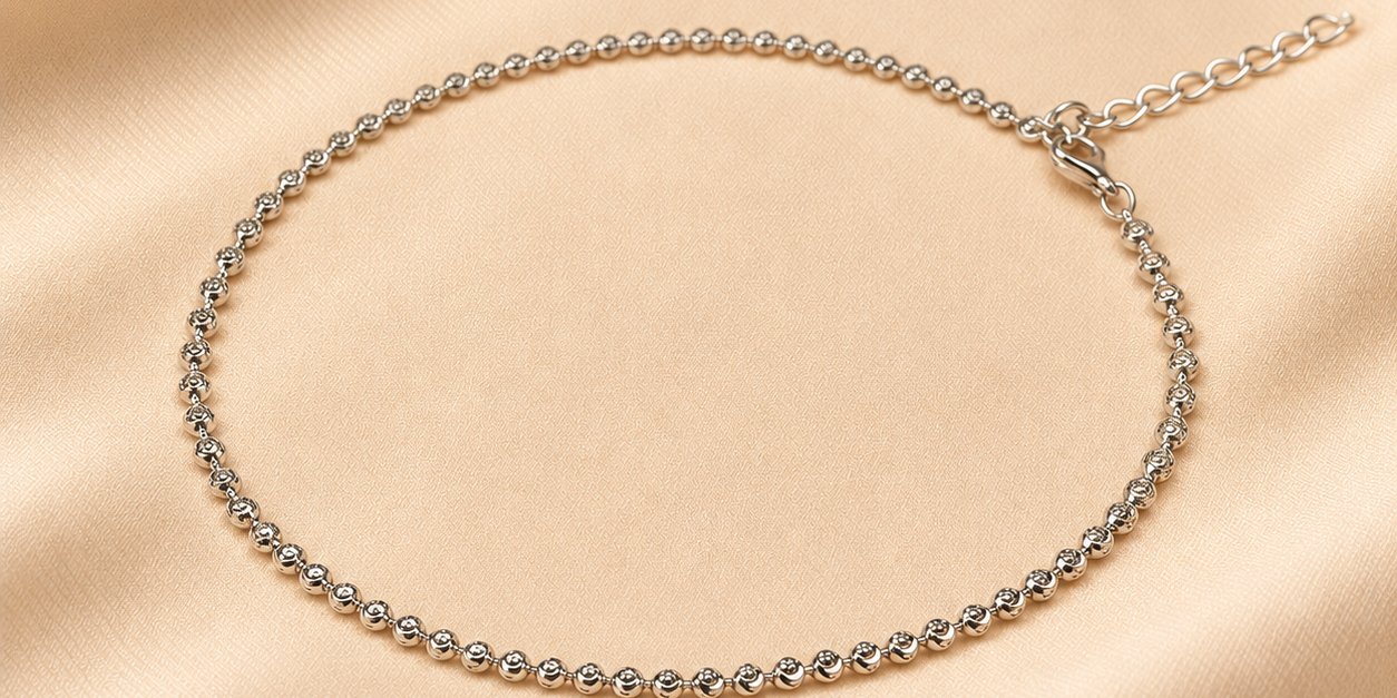 Silver_Beaded_Anklet_on_Champagne_Satin.png